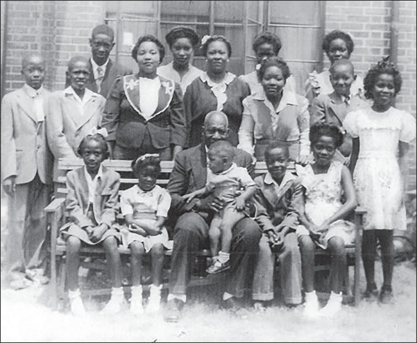 James (18 months) with siblings and cousins in front of his house in the Craven Terrace Projects (1946)